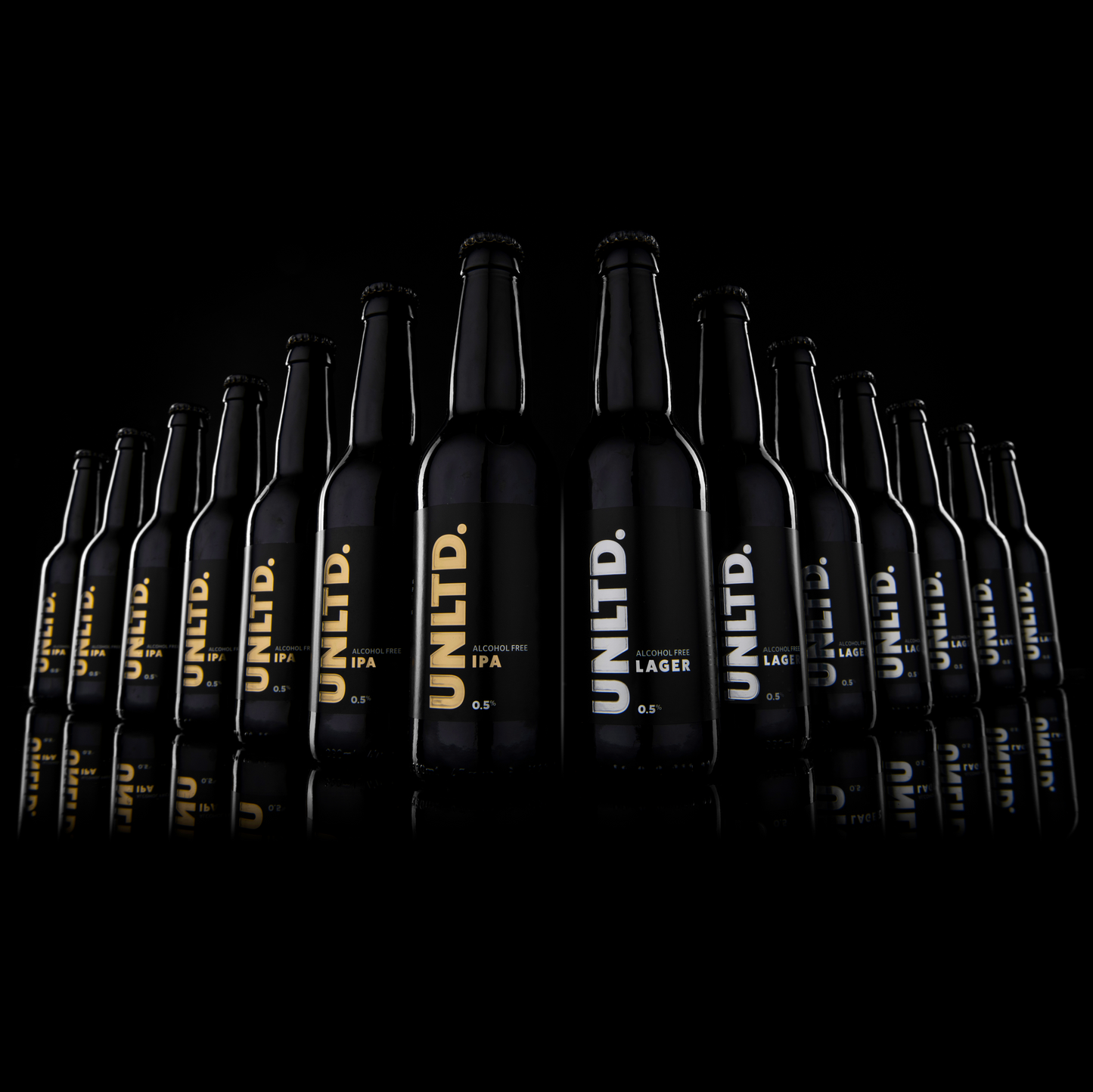 
                  
                    Row of black beer bottles with 'UNLTD.' branding on a black background
                  
                