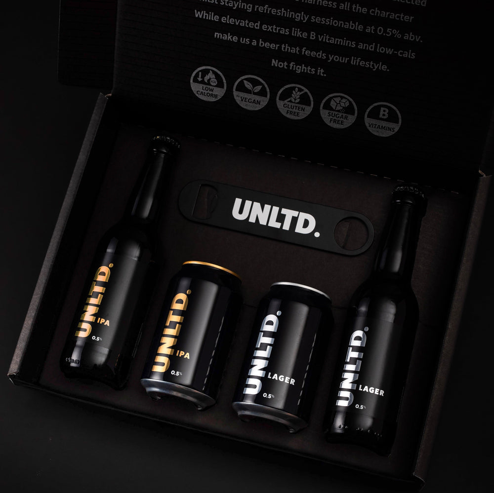 UNLTD beer bottles and cans in a box with brand logo
